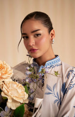 Woman wearing a floral dress with a neutral background